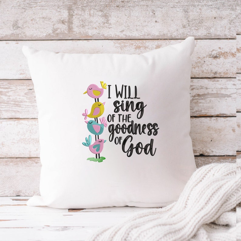 May include: White throw pillow with embroidered colorful birds and the text "I will sing of the goodness of God".