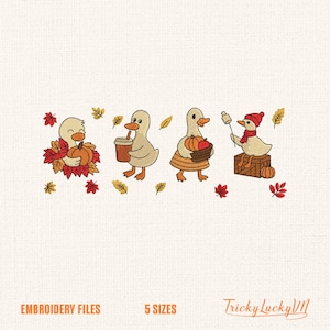 May include: An embroidery design featuring four cartoon ducks celebrating autumn. One duck holds a pumpkin, another a coffee cup, a third carries a basket of pumpkins, and the last roasts a marshmallow. The design includes fall leaves and the text "EMBROIDERY FILES" and "5 SIZES".