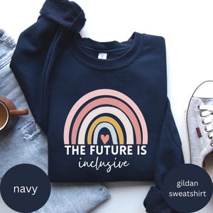 May include: Navy blue Gildan sweatshirt with a rainbow graphic and the text "The future is inclusive".