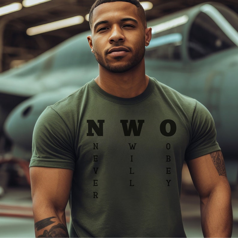 May include: A green t-shirt with the text "NWO" in black letters. The letters are made up of smaller letters that spell out "NEVER WILL OBEY".