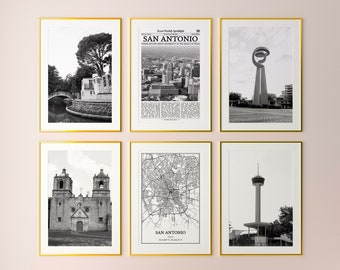 May include: A set of six black and white framed prints featuring various landmarks and scenes from San Antonio, Texas. The prints are arranged in a grid pattern on a pink wall.
