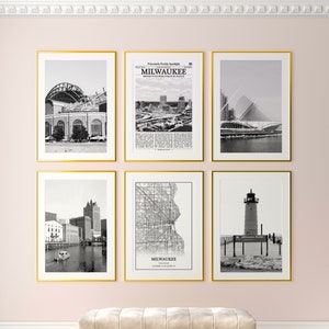 May include: A set of six black and white framed prints featuring various scenes of Milwaukee, Wisconsin. The prints include a view of the city skyline, a baseball stadium, a lighthouse, a map of the city, and a modern art museum.