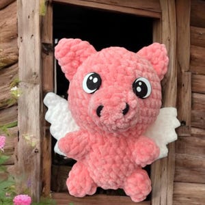 Crocheted flying pig, Pink pig with wings.