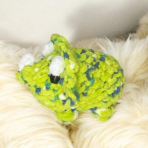 Large crocheted triceratops dinosaur  Green with blue and white speckles