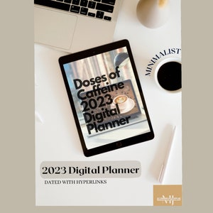 May include: A digital planner with the title "Doses of Caffeine 2023 Digital Planner" on a tablet screen. The tablet is on a white surface with a laptop, a cup of coffee, and a pen.