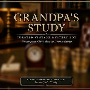 May include: An advertisement for a curated vintage mystery box, with the text "GRANDPA'S STUDY" in gold lettering. The image includes a blurred background of a study with a clock and glasses. The text reads "Timeless pieces. Classic character. Yours to discover."