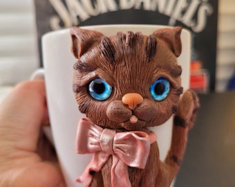 Handmade mug with a cute kitten. Polymer clay decor. Mug with molded decoration.