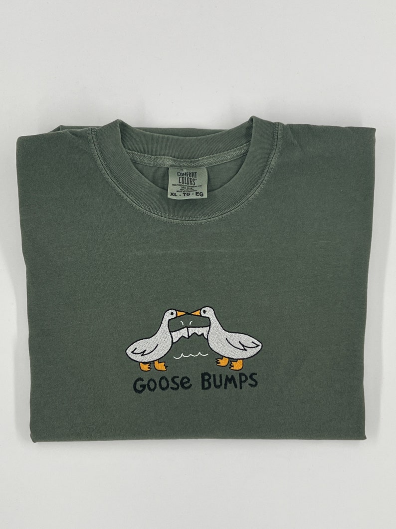 Comfort Colors 1717 Shirt with goose bumps design embroidered on it. Design size is around 3 by 5 inches.