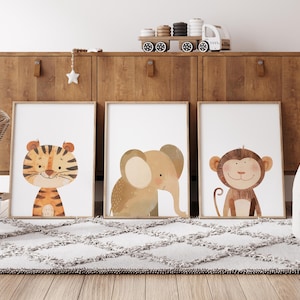 May include: Three framed illustrations of animals, a tiger, an elephant, and a monkey, with a light brown background. The frames are white and the illustrations are in a watercolour style.