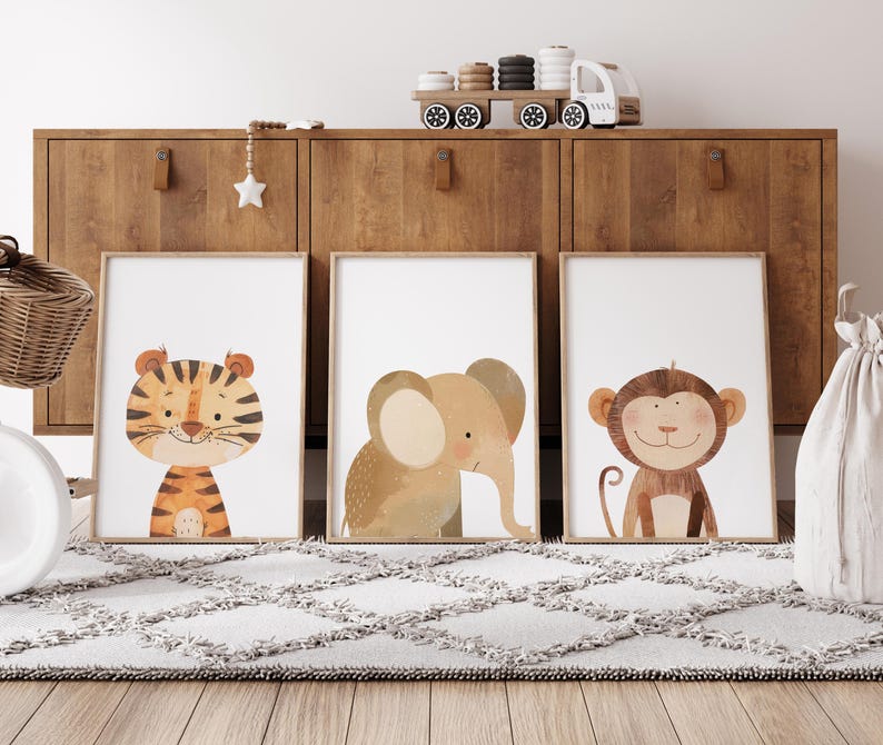 May include: Three framed illustrations of animals, a tiger, an elephant, and a monkey, with a light brown background. The frames are white and the illustrations are in a watercolour style.