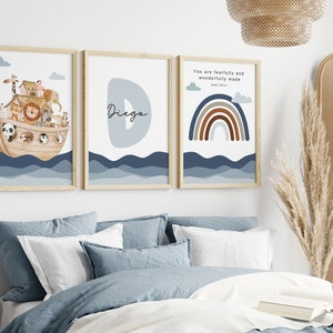 May include: Three framed prints with a nautical theme. The first print features a cartoon illustration of Noah's Ark with animals on board. The second print features a blue letter D with the name "Diego" written in cursive. The third print features a rainbow with brown, orange, and gray stripes and the text "You are fearfully and wonderfully made, Psalm 139:14".