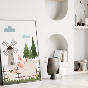 May include: A framed illustration of two pink pigs standing in a field with a windmill in the background. The illustration is in a cartoon style with a white background and green trees.