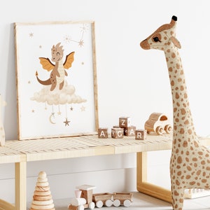 May include: A framed print of a cartoon brown dragon with orange wings on a cloud with stars and a crescent moon. The print is hanging on a wall above a wooden bench with a giraffe toy and wooden blocks that spell out "ZIG ZAG".