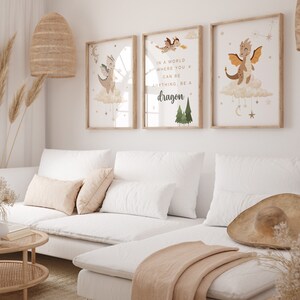 May include: Three framed prints with illustrations of dragons and stars. The middle print has the text "In a world where you can be anything, be a dragon."