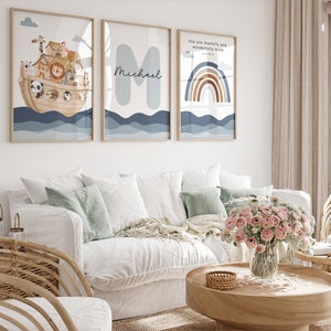 May include: Three framed prints with a nautical theme. The first print features a cartoon illustration of Noah's Ark with animals on board. The second print features the name "Michael" in a blue font. The third print features a rainbow with the text "You are fearfully and wonderfully made" and a scripture reference.