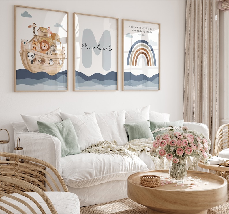 May include: Three framed prints with a nautical theme. The first print features a cartoon illustration of Noah's Ark with animals on board. The second print features the name "Michael" in a blue font. The third print features a rainbow with the text "You are fearfully and wonderfully made" and a scripture reference.