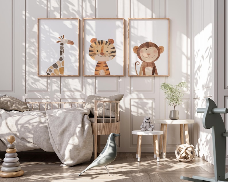 May include: Three watercolour animal illustrations in frames on a white wall. The illustrations are of a giraffe, a tiger, and a monkey. The frames are brown wood and the illustrations are on white paper.