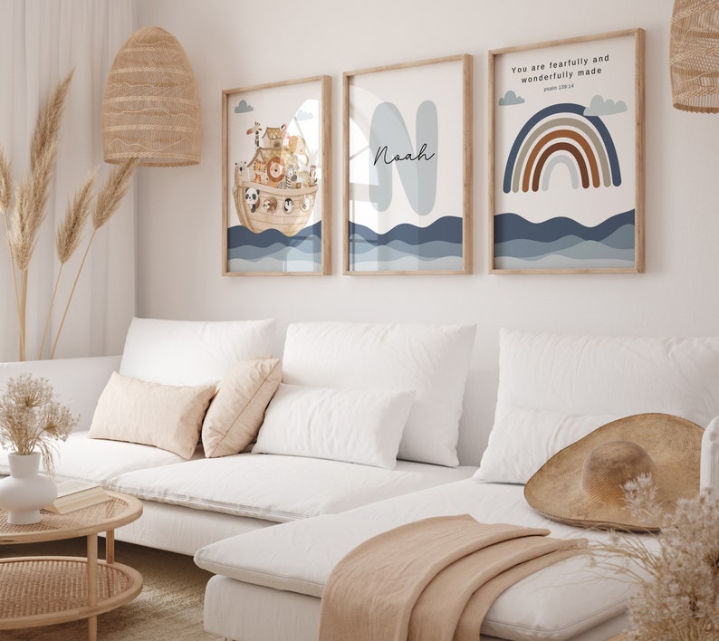 May include: Three framed prints with a nautical theme. The first print features a cartoon illustration of Noah's Ark with animals on board. The second print features the name Noah in a blue and white font. The third print features a rainbow with brown and orange stripes and the text "You are fearfully and wonderfully made" with a reference to Psalm 139:14.