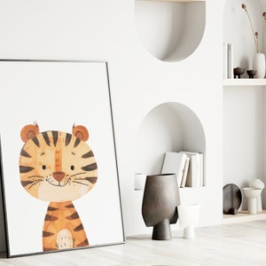 May include: A framed print of a cartoon tiger with orange and brown stripes. The tiger has a friendly expression and is looking directly at the viewer.