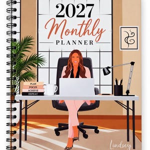 May include: A 2027 Monthly Planner spiral-bound notebook featuring an illustration of a person in a pink suit sitting at a desk with a laptop, a mug, and a stack of books labeled PLAN, FOCUS, ACHIEVE, REPEAT. The name Lindsey is written in the corner.
