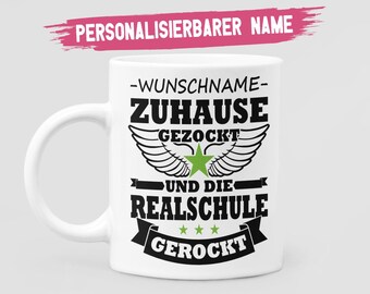 May include: White ceramic mug with black text that reads "PERSONALISIERBARER NAME -WUNSCHNAME- ZUHAUSE GEZOckt UND DIE REALSCHULE GEROckt" with three stars and a green star with wings.