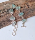 Raw Aquamarine Sterling Silver Bracelet: Handmade Gemstone Jewelry product logo