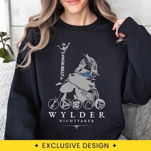 May include: A black long-sleeve sweatshirt featuring a gray graphic of a helmeted figure holding a sword. Below the figure are five circular icons and the text "WYLDER NIGHTFARER" in white capital letters with a small decorative line underneath.