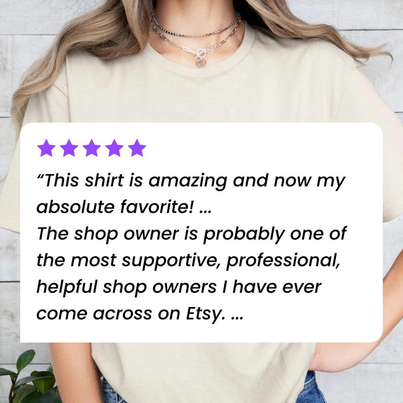 May include: A light-colored t-shirt with a customer review displayed on a white rectangle. The review includes text about the shirt and the shop owner. Five purple stars are at the top of the review.