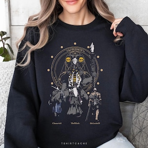 May include: Black sweatshirt featuring a detailed graphic of a fantasy character with a staff, surrounded by other figures and a circular design. The names "Chaser45", "TheWitch", and "McLovin99" are below the figures. The text "TSHIRTCACHE" is at the bottom.