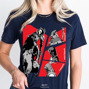May include: Navy blue t-shirt featuring a graphic design with four panels of black and white figures on a red background. The text "ironyeye99" and "underTaken99" are visible. The shirt also has the text "NAVY TSHIRTCACHE".
