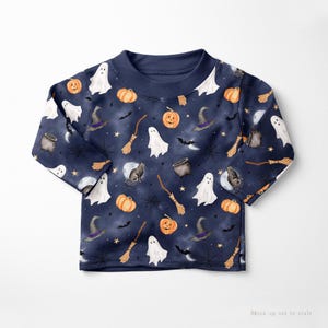 Seamless Halloween pattern featuring ghosts, witches, bats, and pumpkins in a festive design on a misty blue background