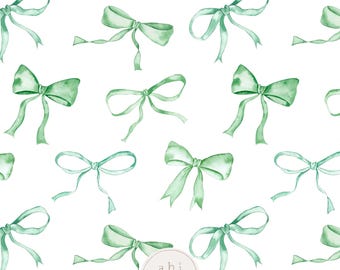 Può includere: Un motivo ripetuto di fiocchi ad acquerello in tonalità verdi su sfondo bianco. I fiocchi variano per dimensioni e stile, con lunghi nastri fluenti. Il design include il testo "abi boyd DESIGNS".