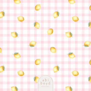 May include: A repeating pattern of yellow lemons with green leaves scattered across a pink and white gingham background. The design includes the text "abi boyd DESIGNS" in the lower right corner.