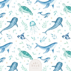 May include: A repeating watercolour pattern of marine life, including whales, turtles, jellyfish, and stingrays, in blue and green hues. The design incorporates sprigs, bubbles, and stars on a white backdrop. The text "abi boyd DESIGNS" is in the lower right corner.