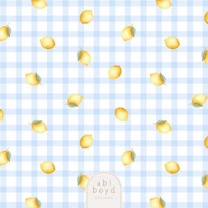 May include: A repeating pattern of yellow lemons with green leaves scattered across a light blue and white gingham background. The design has a watercolor effect, creating a fresh and summery feel. The text "abi boyd DESIGNS" is in the lower right corner.