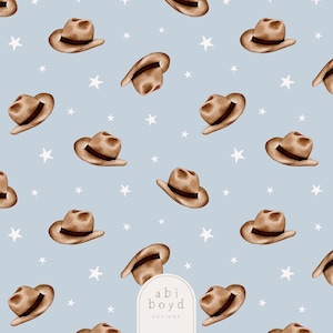 May include: A repeating pattern of brown cowboy hats with dark brown bands and white stars on a light blue background. The hats are arranged in various orientations. The image includes the text "abi boyd DESIGNS".