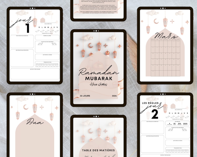 May include: A printable Ramadan planner with a pink and gold color scheme. The planner includes a calendar, daily pages, and a table of contents. The text on the cover reads "Ramadan Mubarak" in Arabic and English.