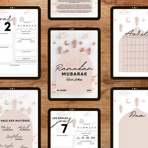 May include: A printable Ramadan planner with a pink and gold color scheme. The planner includes a calendar, daily journal pages, and a table of contents. The text "Ramadan Mubarak" is written in Arabic and English.