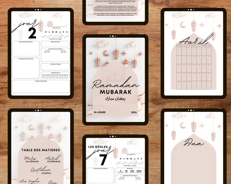 May include: A printable Ramadan planner with a pink and gold color scheme. The planner includes a calendar, daily journal pages, and a table of contents. The text "Ramadan Mubarak" is written in Arabic and English.