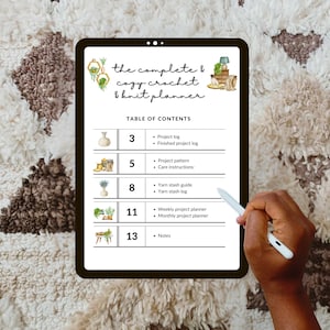 May include: A digital tablet displaying a table of contents for a crochet and knit planner. The planner includes sections for project logs, patterns, yarn stash, and weekly and monthly project planning.