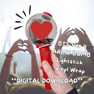 May include: A red and clear lightstick with a large red heart design. The lightstick has the text "BTS Ver 4 ARMY BOMB Lightstick Vinyl Wrap" and "**DIGITAL DOWNLOAD**". The lightstick is held up in front of a crowd.
