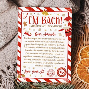 May include: A festive Christmas letter with red and white striped borders, featuring the text "I'M BACK! I MISSED YOU SO MUCH!" and a message from an elf. The letter includes decorative elements like snowflakes, stars, and a North Pole Express Delivery stamp.