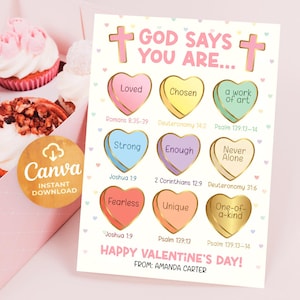 May include: A Valentine's Day card with the text "GOD SAYS YOU ARE..." and heart-shaped candies with positive affirmations. The card is decorated with pink crosses and hearts. Cupcakes are in the background.