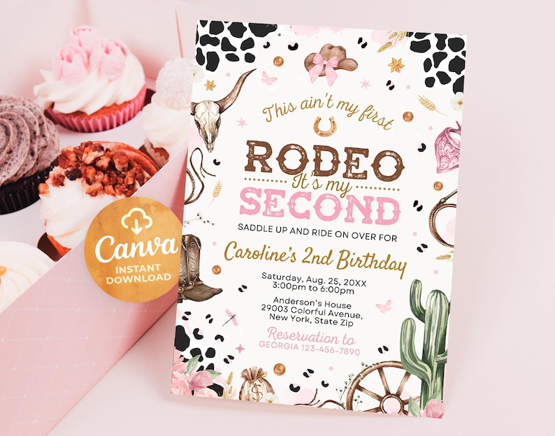 May include: A pink and brown invitation for a second birthday party with a rodeo theme. The invitation features a cowboy hat, boots, a cactus, and a wagon wheel. The text on the invitation reads "This ain't my first rodeo. It's my second. Saddle up and ride on over for Caroline's 2nd Birthday."