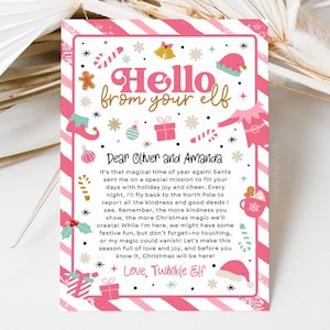 May include: A pink and white Christmas-themed letter from an elf. The letter includes the text "Hello from your elf" and "Dear Oliver and Amanda". The letter is decorated with Christmas-themed illustrations, such as candy canes, gifts, and elf hats.