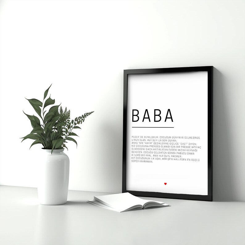 May include: Black and white framed print with the word "BABA" in large letters at the top. The text below defines the word "BABA" in Turkish.