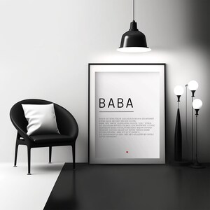 May include: Black and white minimalist art print with the word "BABA" in bold text and a short poem in Turkish. The print is framed and hanging on a white wall in a modern interior design setting.