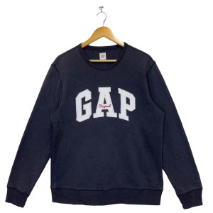 May include: A dark blue sweatshirt with a white "GAP Original" logo on the front.