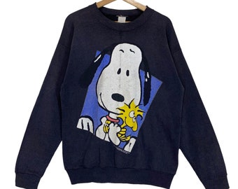 ¡RARO! Sudadera vintage de cuello redondo con personajes de Peanuts de los 90. Sudadera con logo grande de Peanuts. Talla M.