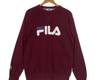 Sudadera vintage de los años 90 con cuello redondo y logo grande de Fila. Suéter Fila. Sudadera con cuello redondo y logo grande de Fila. Talla M.